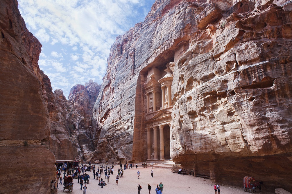 Tourists in Petra Treasury Jordan