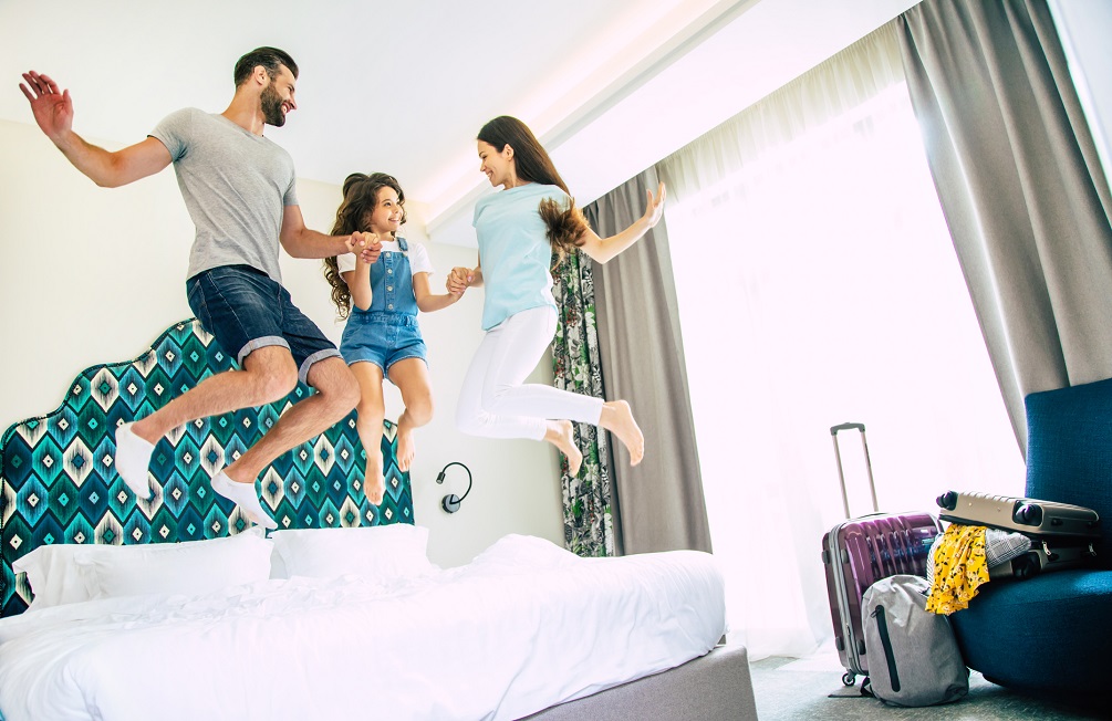 FAmily playing in hotel room