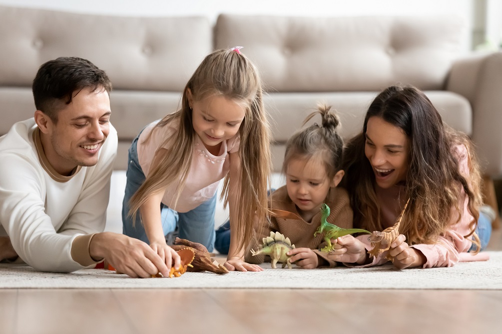 Family playing dinosaurs