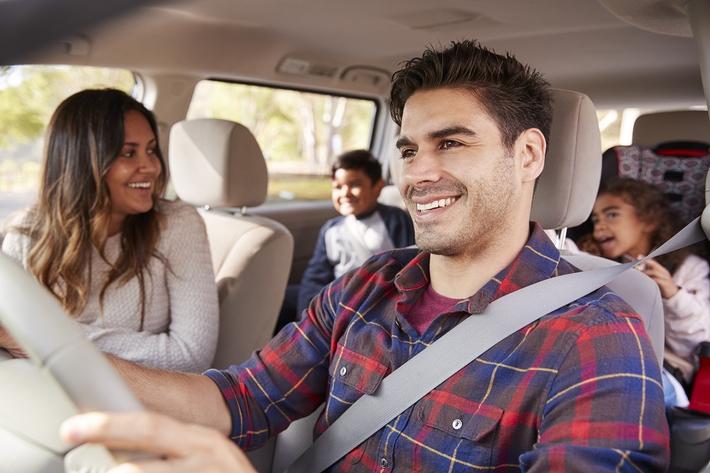 family playing in car