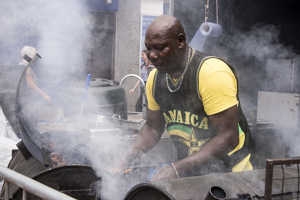 Jamaican chef cooking jerk chicken
