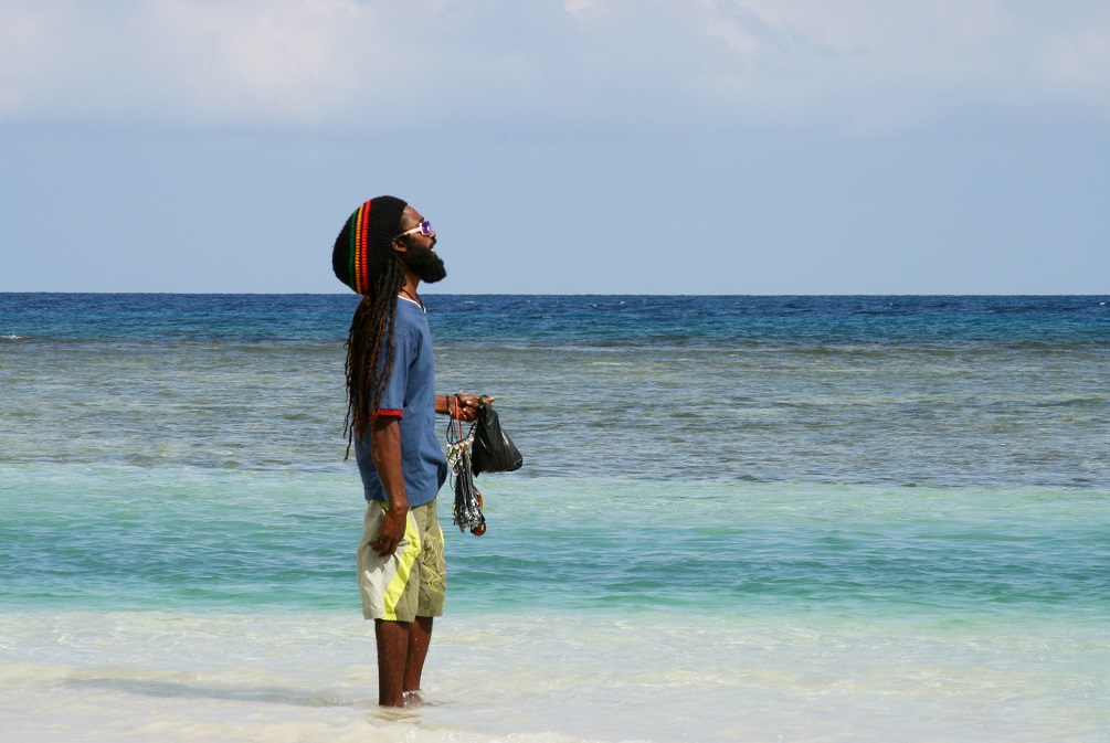 Jamaican man overlooking the sea