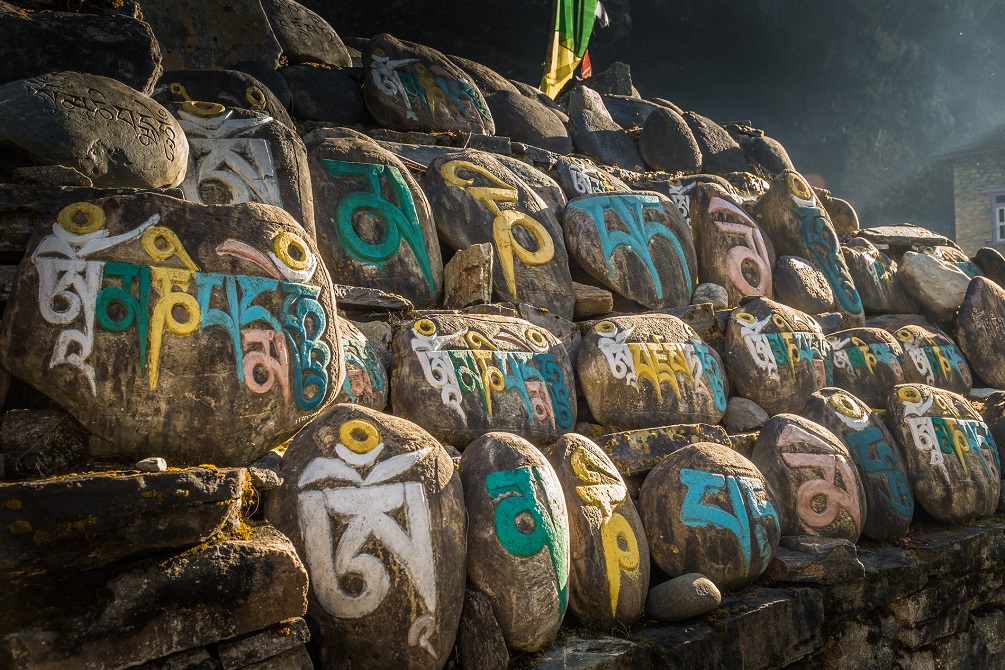 Nepalese symbols carved on the stones