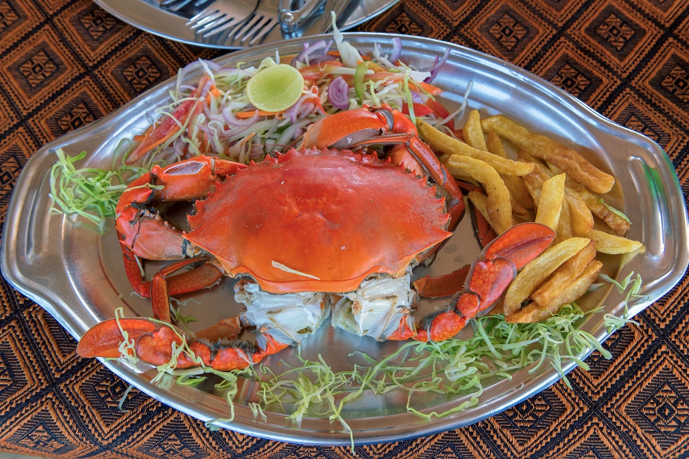 Plate with crabs in a beach restaurant 