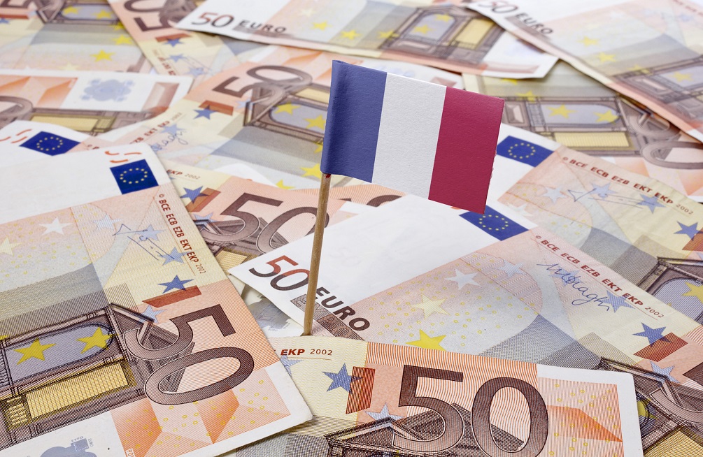 Flag of France sticking in 50 Euro banknotes