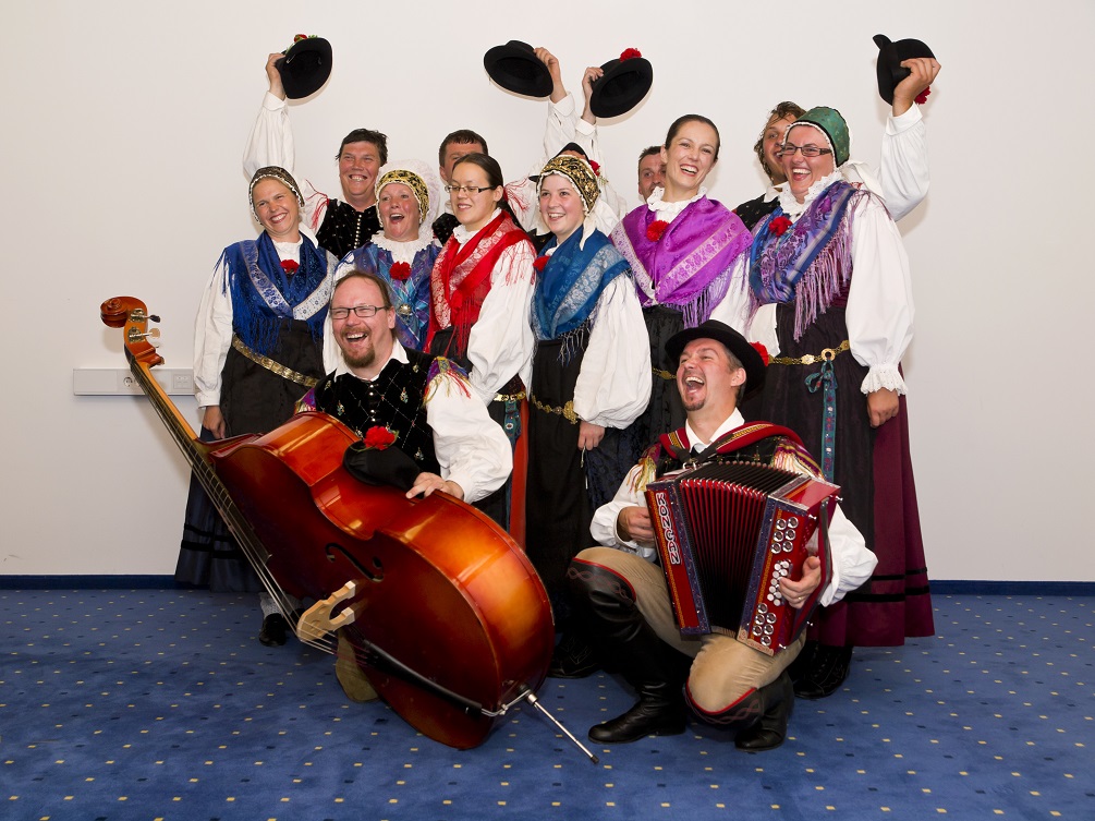 Group of Slovenian dancers and musicians in traditional Slovenian costumes 