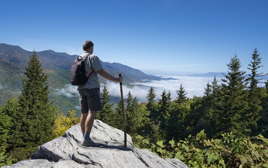 Man relaxing on hiking trip in the mountains.