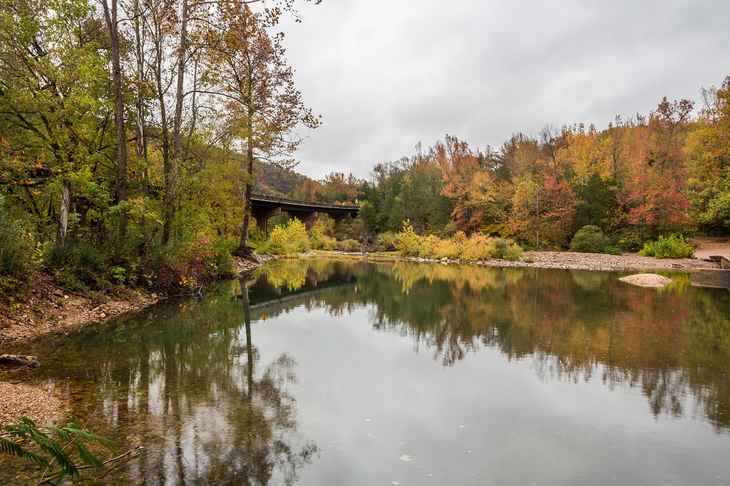 Autumn colors and calm water reflection in the lake